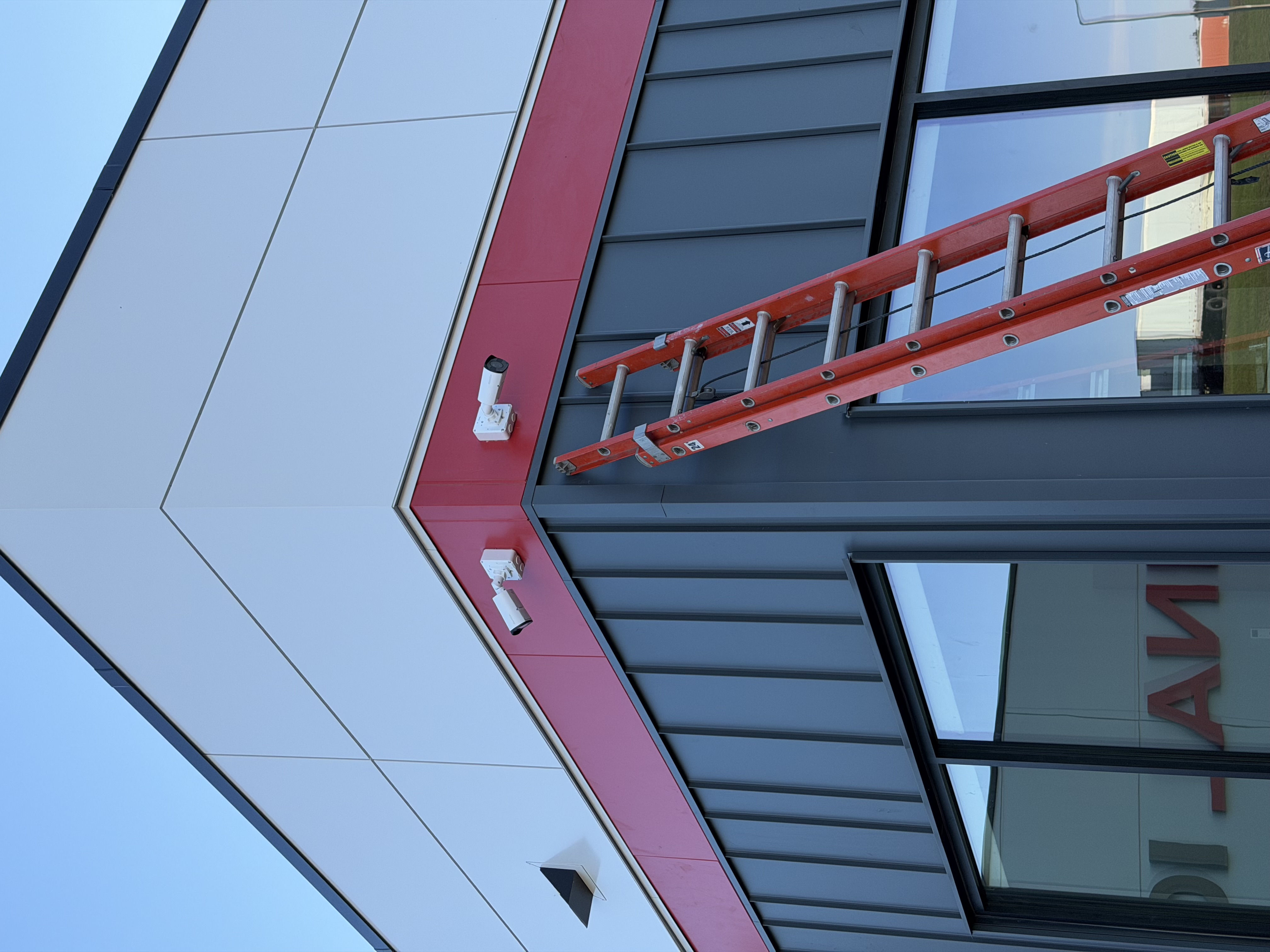 Two security cameras installed on the exterior of a building